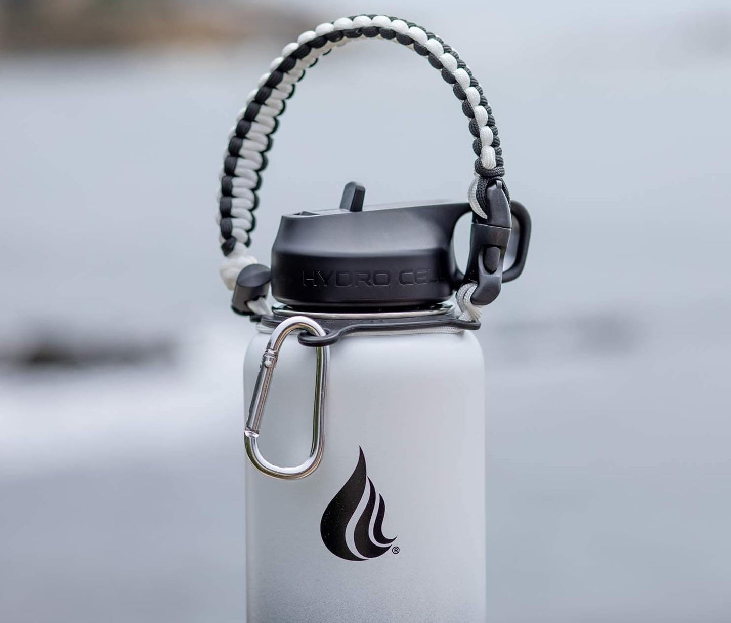 HYDRO CELL Paracord Handle for Wide Mouth Water Bottles - Carrier Strap w/Attachment Ring and Carabiner Accessory. Compatible w/ 64oz, 40oz 32oz, 24oz, 18oz, 14oz Insulated Bottles (Black/White)